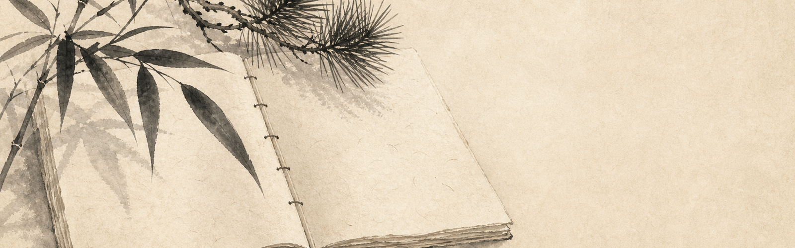 Open washi notebook with bamboo and pine sprigs in sumi-e wash